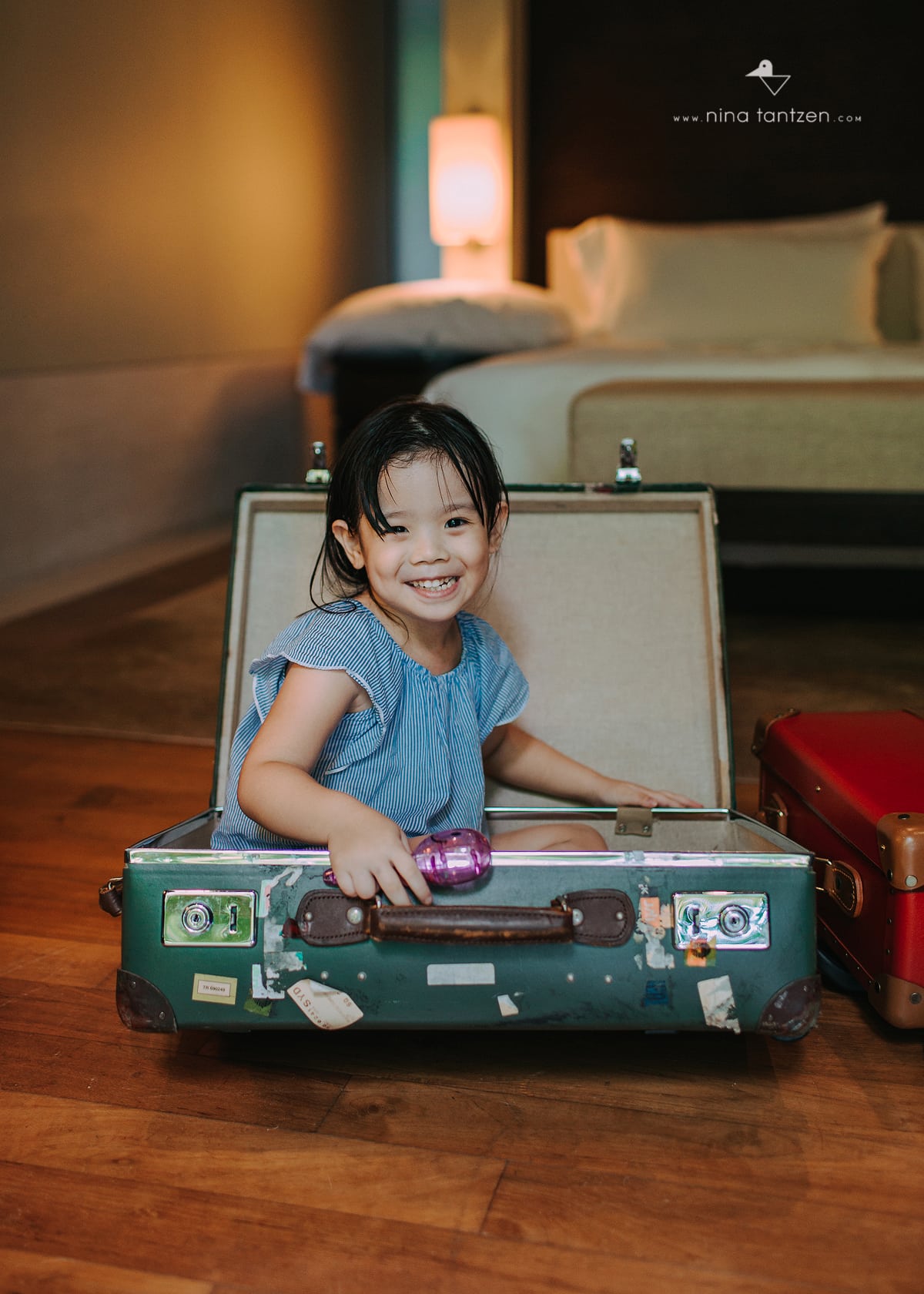 photo of girl in a suitcase in singapore