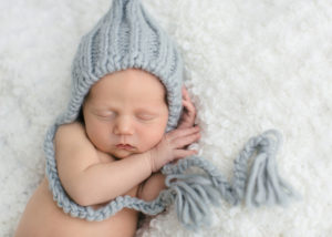 newborn baby boy with blue hat