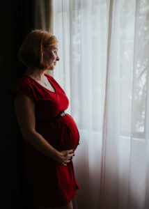 pregnant woman by the window