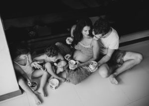 pregnant mom eating ice-cream with family