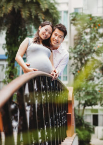 pregnant couple on bridge
