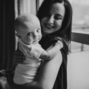mom carrying baby girl