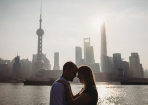 portrait of a couple in front of the Shanghai skyline