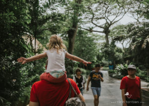 little girl on her dads shoulders