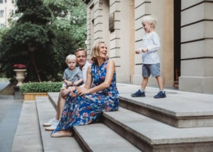 authentic family portrait on steps in a garden in Shanghai