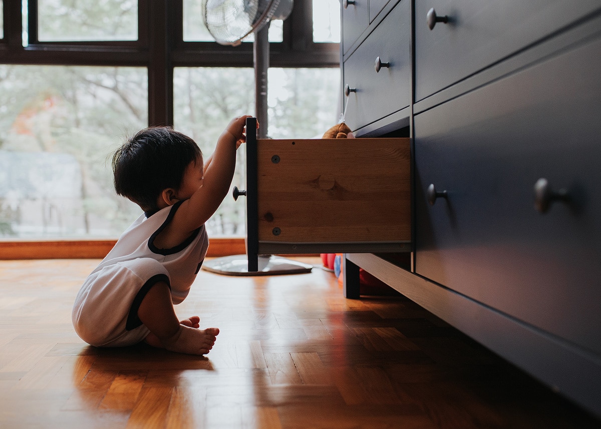 photo of baby opening a drawer