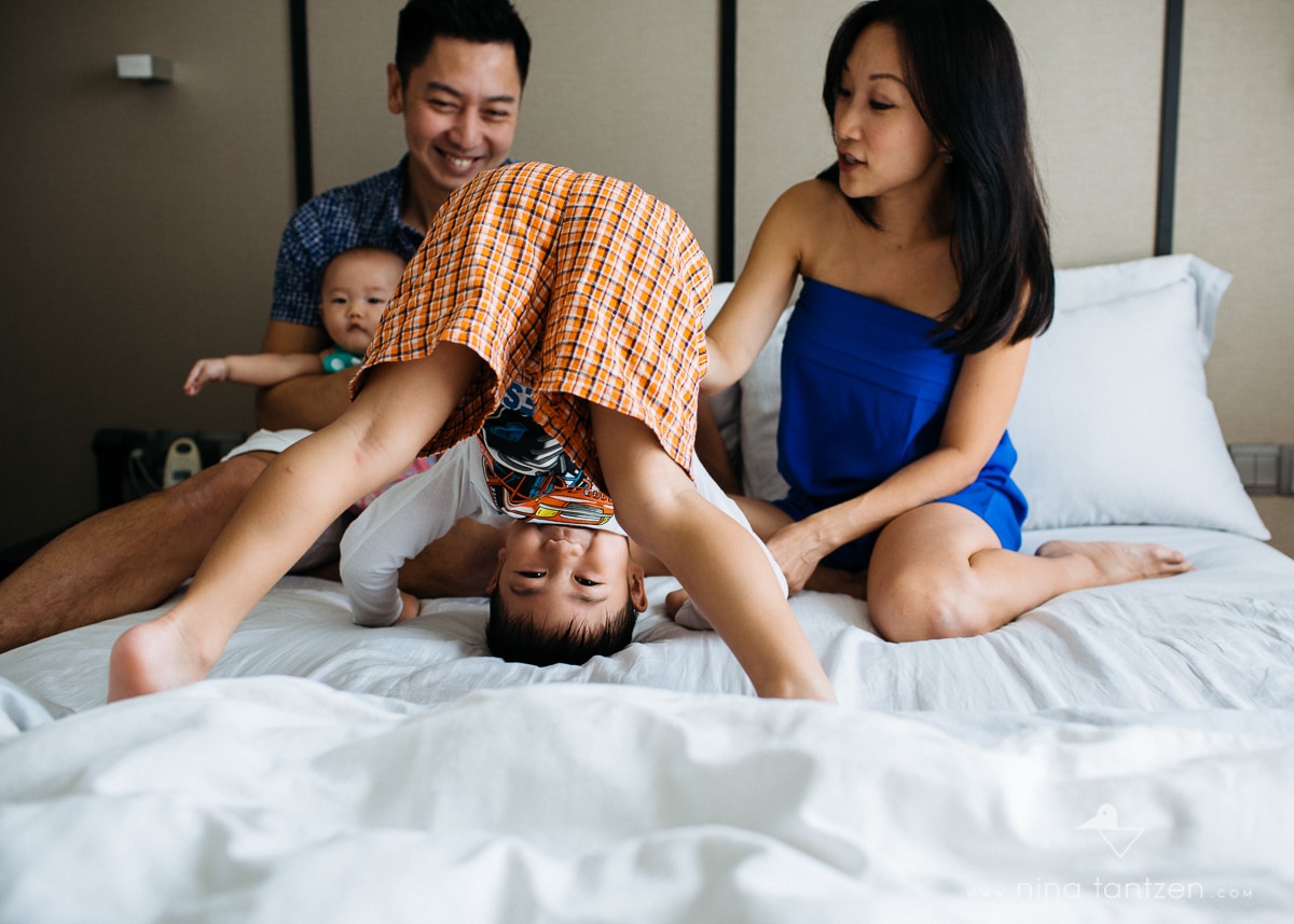 professional photo of family on the bed in singapore
