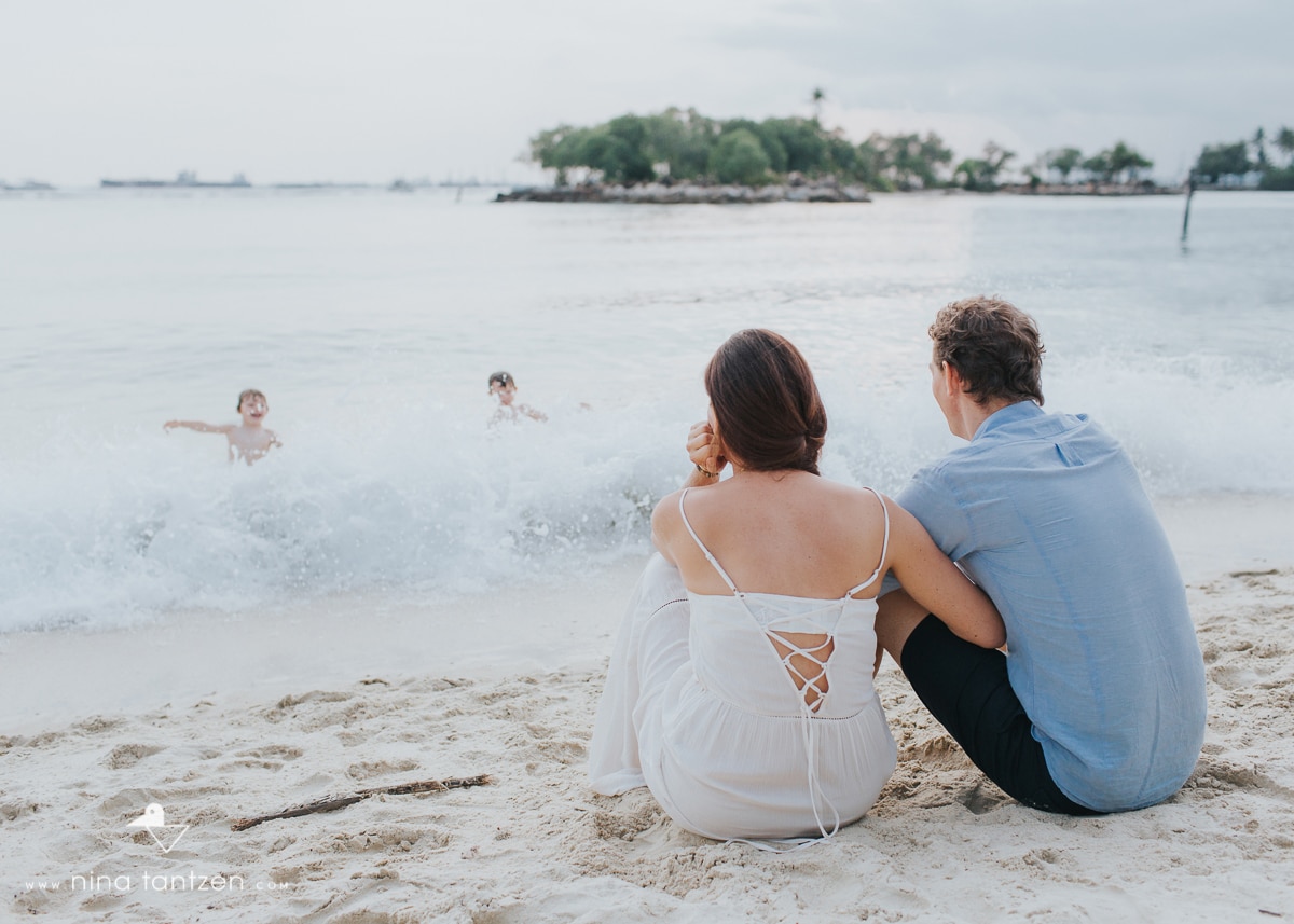 photo of parents watching children in the water in singapore
