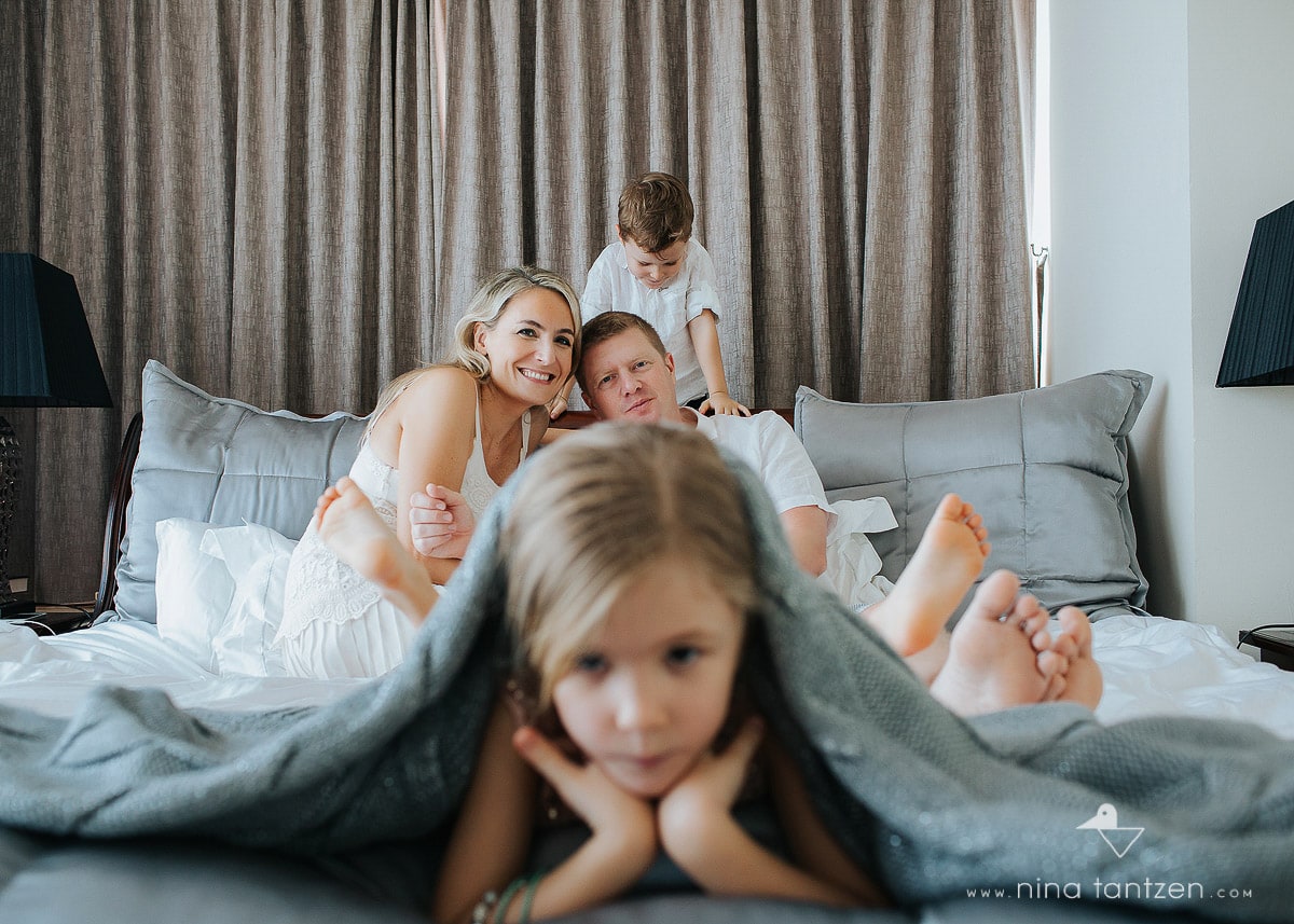 portrait of girl and family in the background