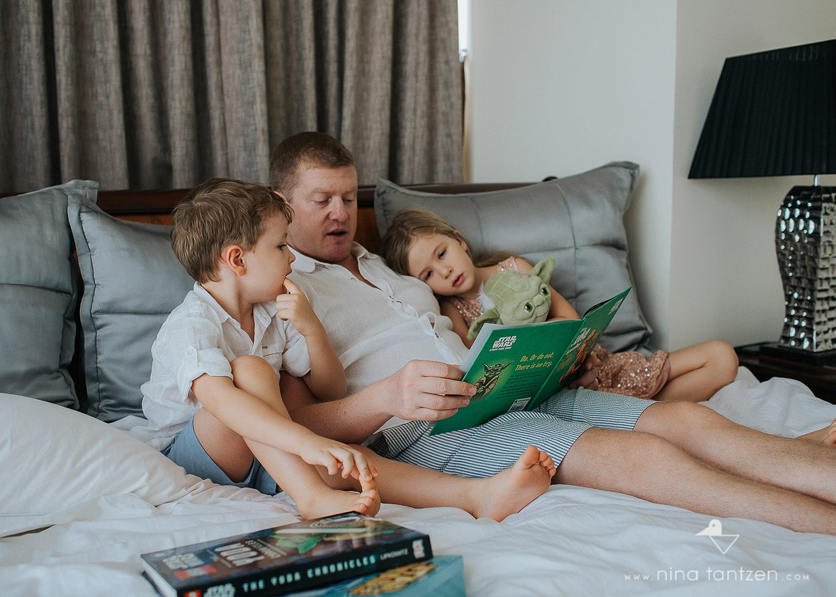 dad and his children reading a story