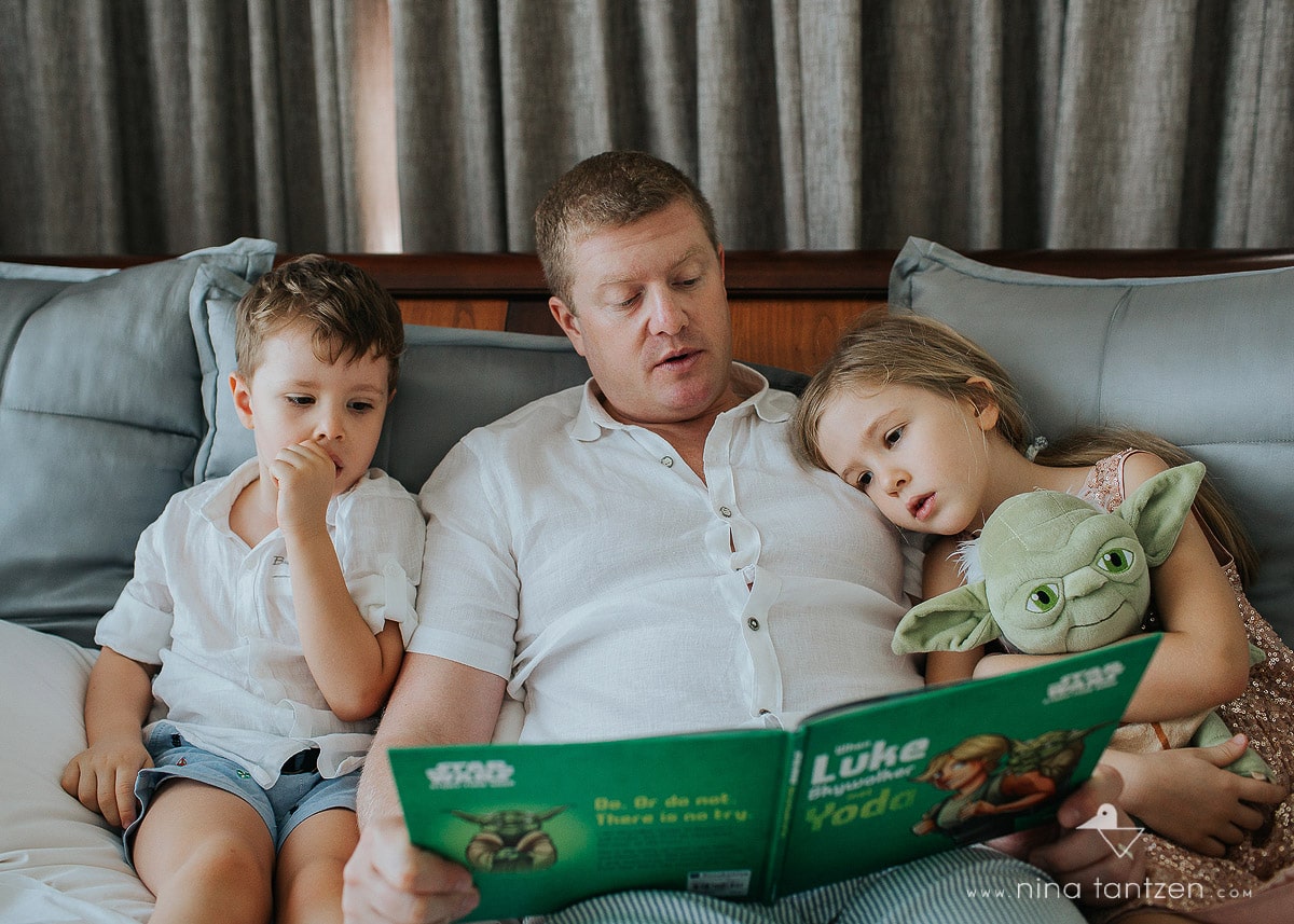 story time with dad and two kids