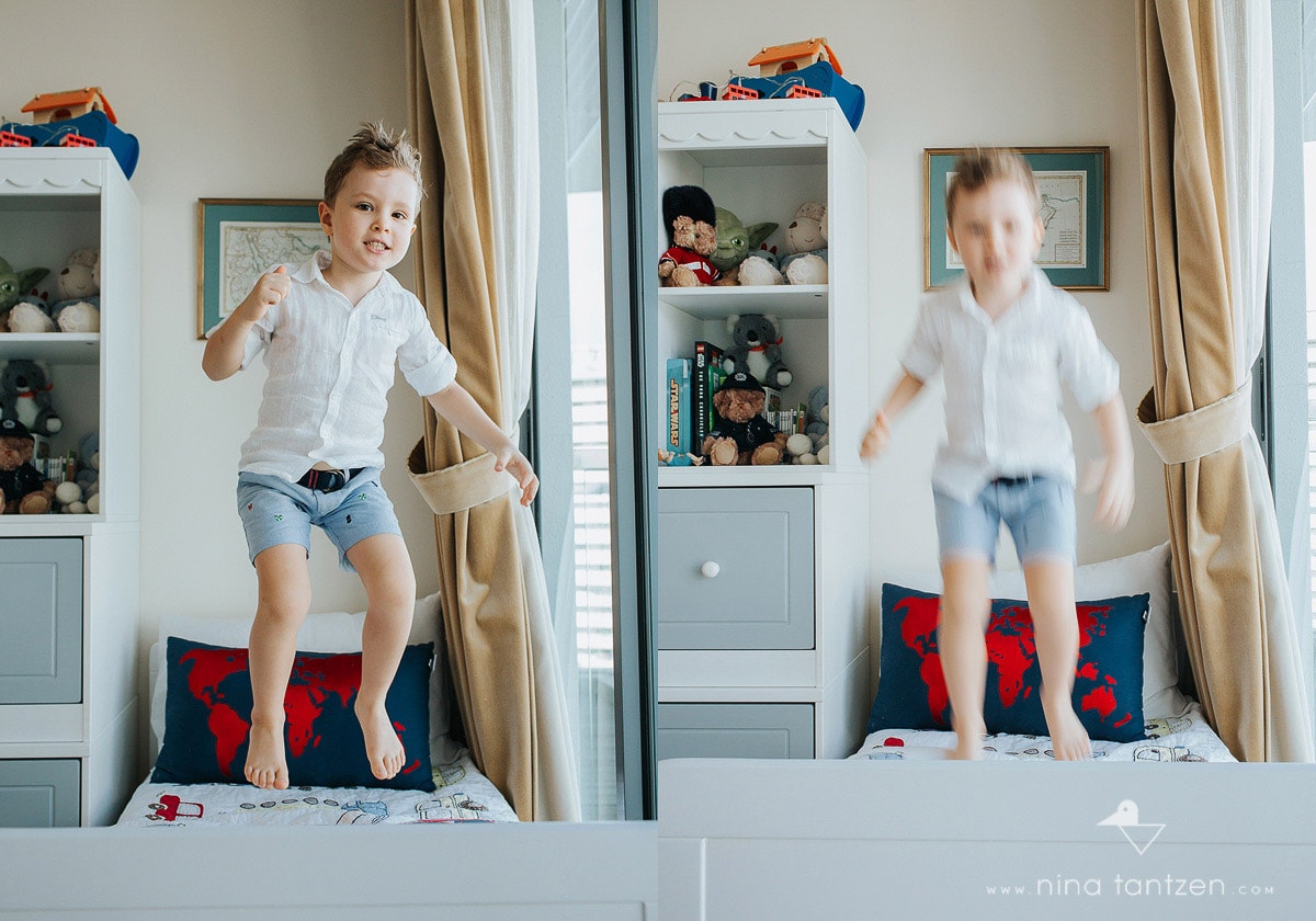 little boy jumping on his bed