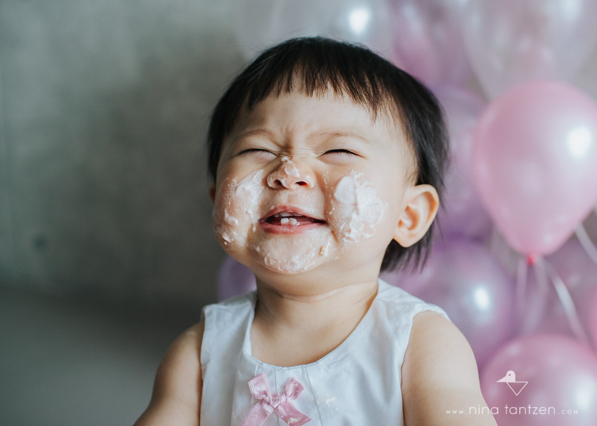 toddler face full of cake