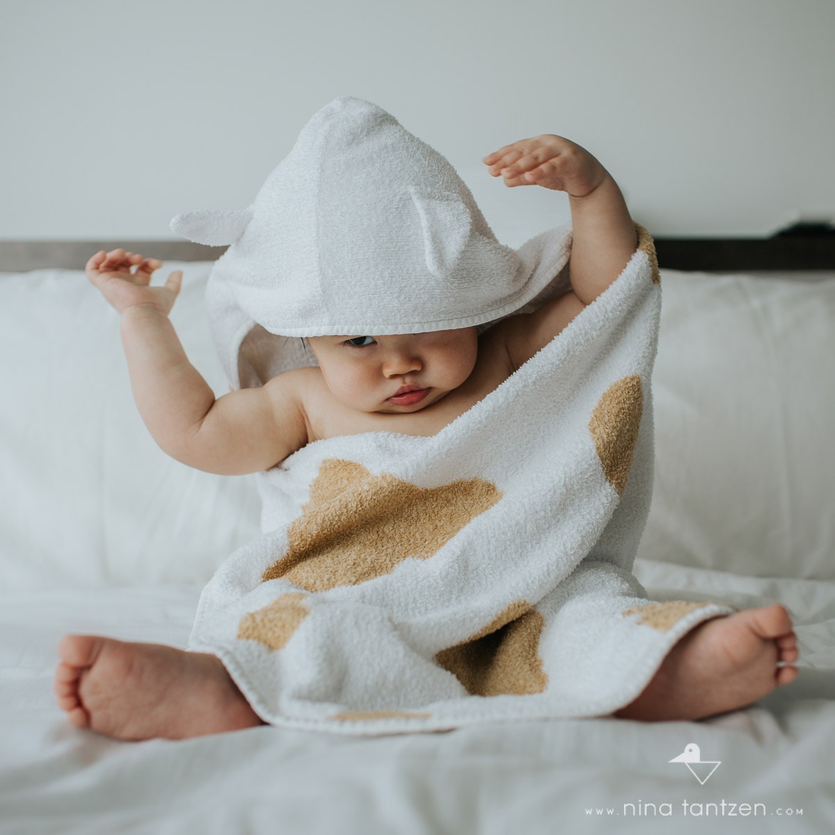 cute toddler wrapped in towel