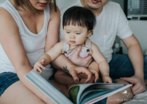 baby girl with a book