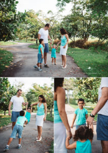 parents swinging their daughter in the air