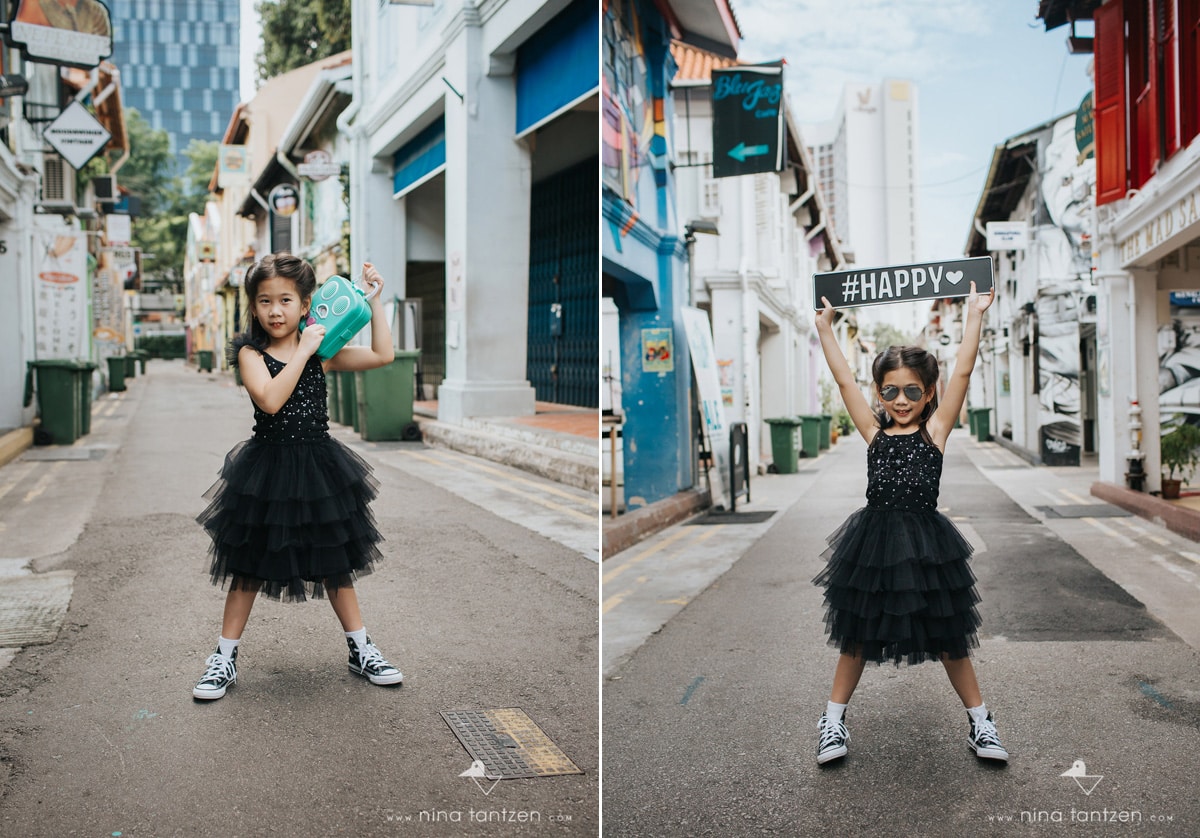 portraits of little girl holding a sign