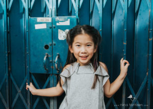 photo of little girl with blue background