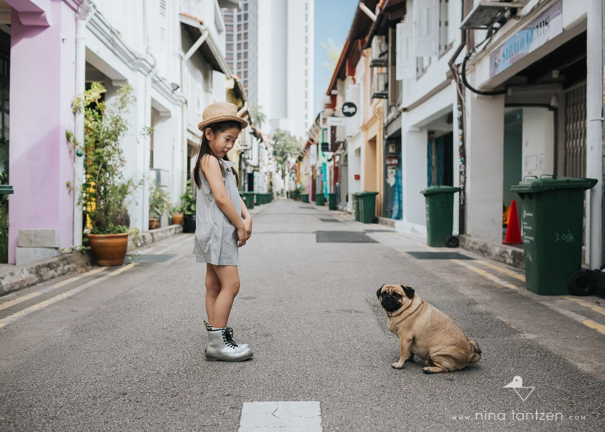 portrait of a girl and a dog on haji lane