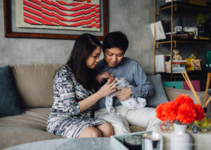 parents looking at their baby girl adoringly