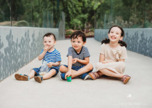 portrait of three siblings in Botanic Gardens