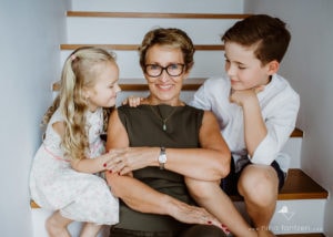 children sitting with their grandmother