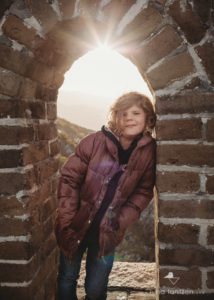 portrait of girl on great wall of china at sunset