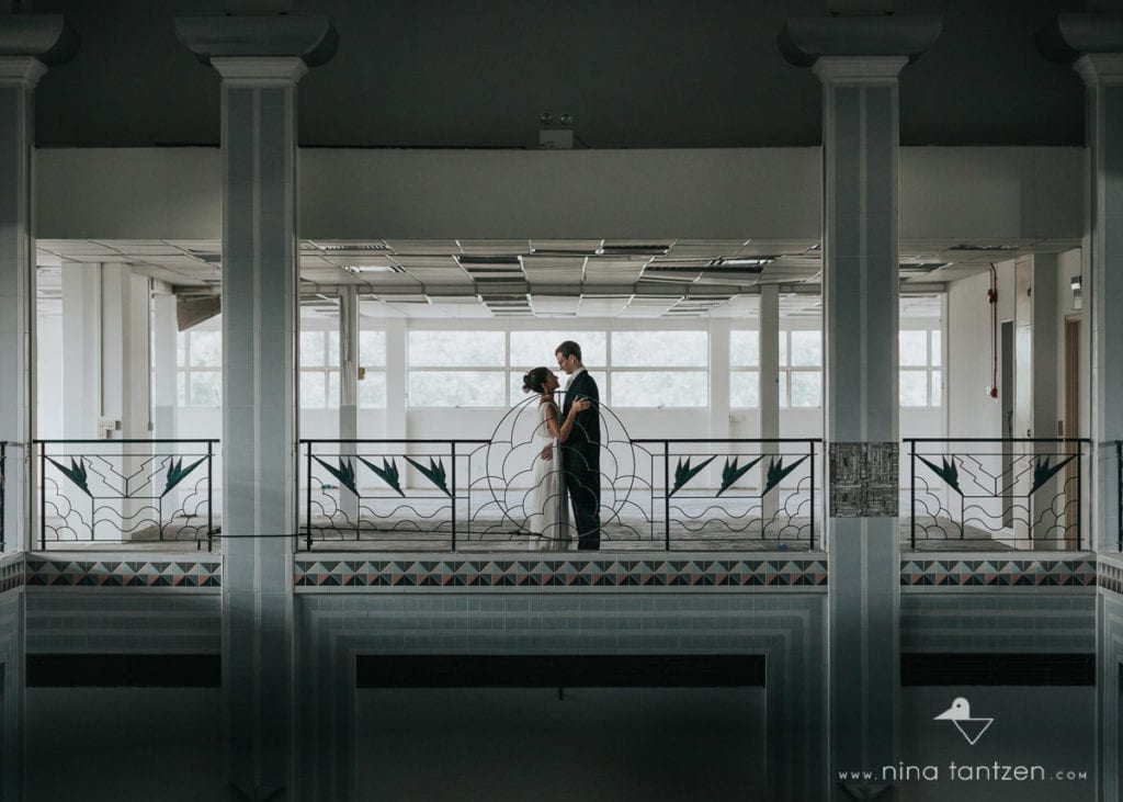 couple hugging in old empty building