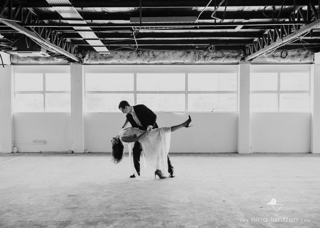 couple dancing in industrial building