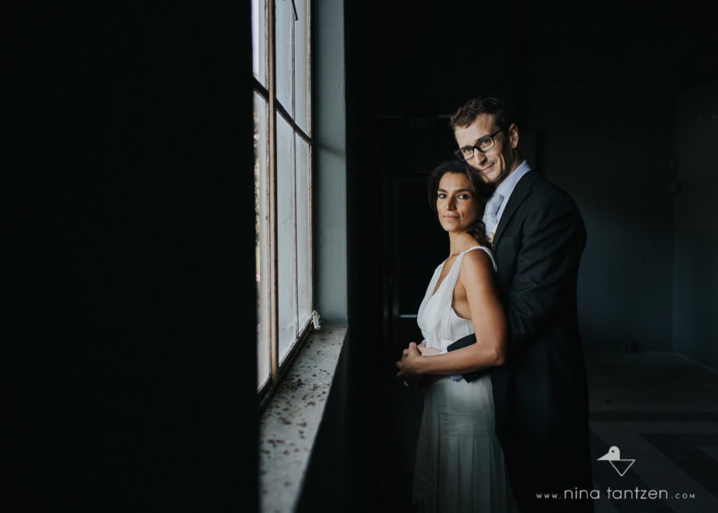 couple standing by the window