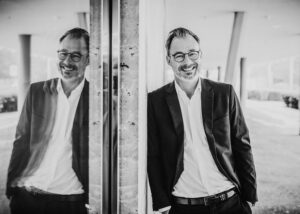 black and white personal branding shot of man in suit