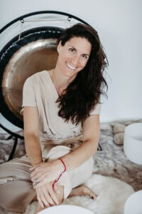 Personal Branding Portrait of a woman in front of a gong instrument